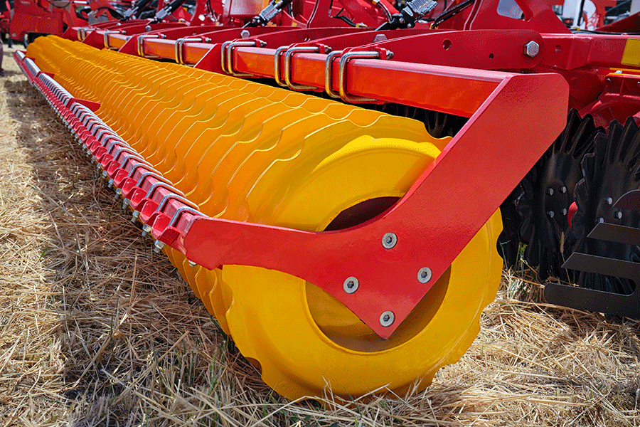 _Construction_machinery_shutterstock_2480258963 Agricultural equipment close-up. Yellow wheels and red construction