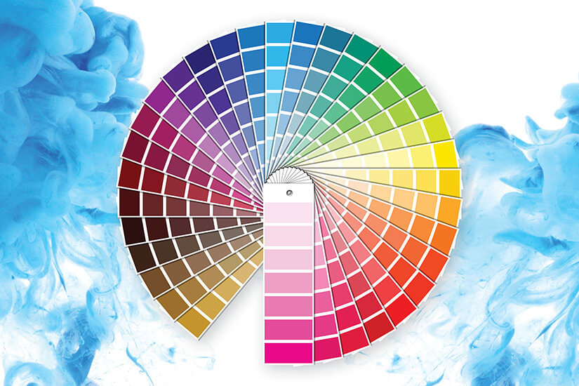 HGMIX-helios-group Color fan deck displaying a wide range of paint colors for professional and home use, set against a vibrant blue background.