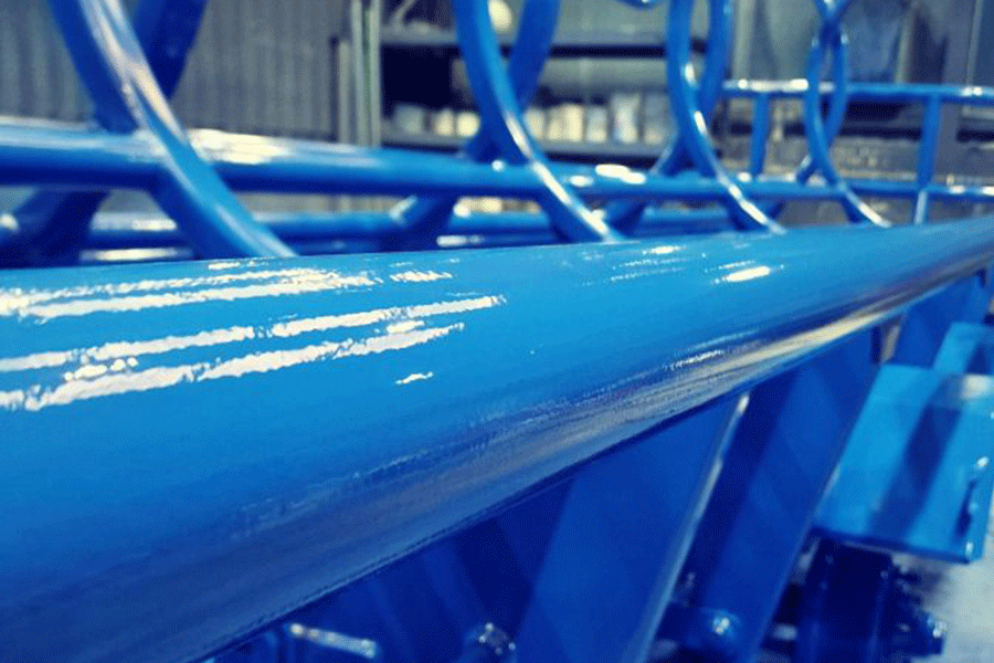 HelioPur_(c)AdvancedCoatings_NOTSHUTTERSTOCK Close-up of a freshly coated construction equipment with shiny blue surface