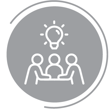 three people sitting at a table and thinking, symbolized by a light bulb in the middle of them