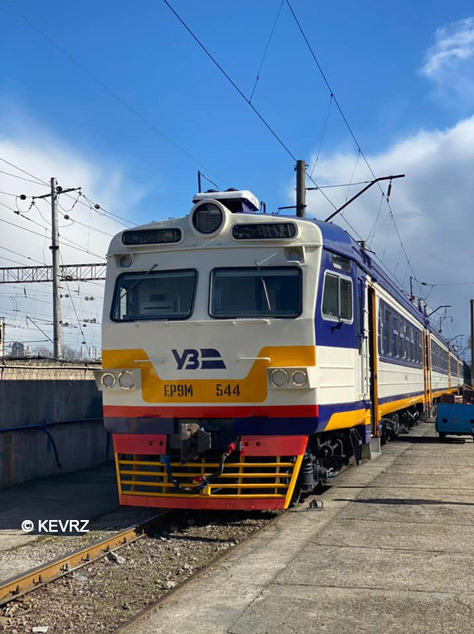 Blue and white regional train at a station