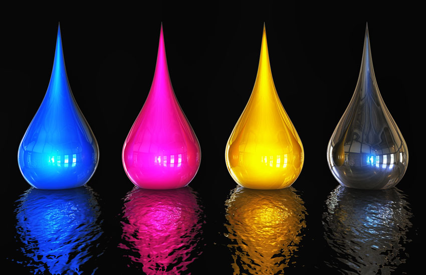 Sol-Gel-Printing-Inks Four glossy color drops in cyan, magenta, yellow, and black (CMYK) on a reflective black surface, symbolizing digital printing ink colors.
