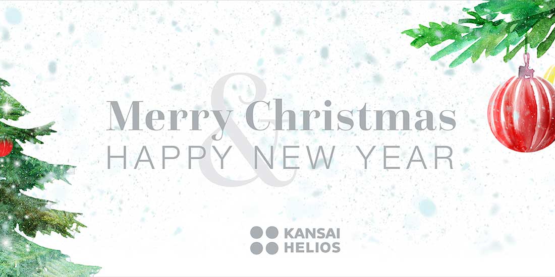 XMas2023 Festive banner with "Merry Christmas & Happy New Year" text, featuring a snowy background, decorated tree, red ornament, and the KANSAI HELIOS logo at the bottom.