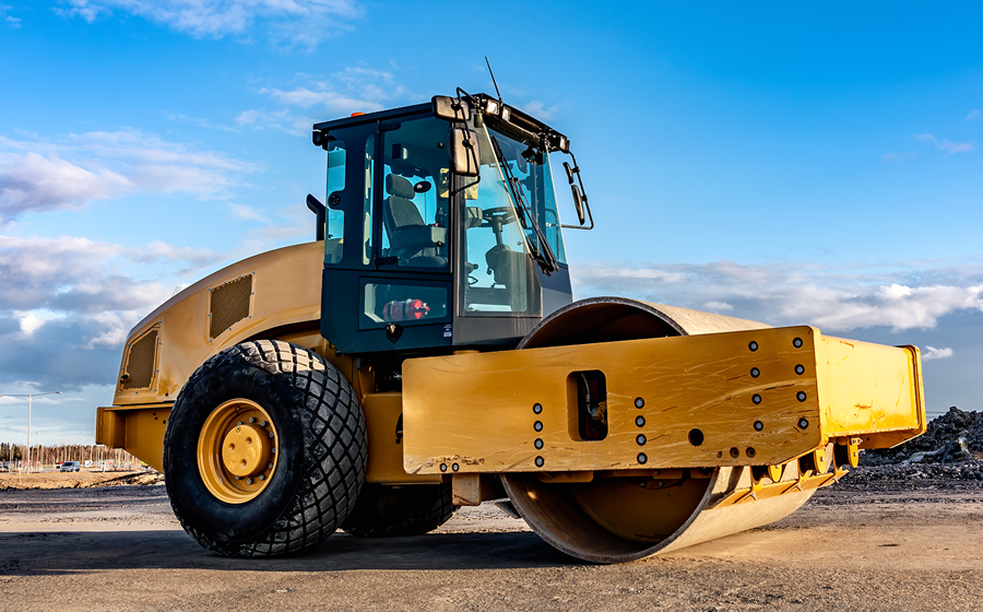 Large industrial roller outdoors on a construction site
