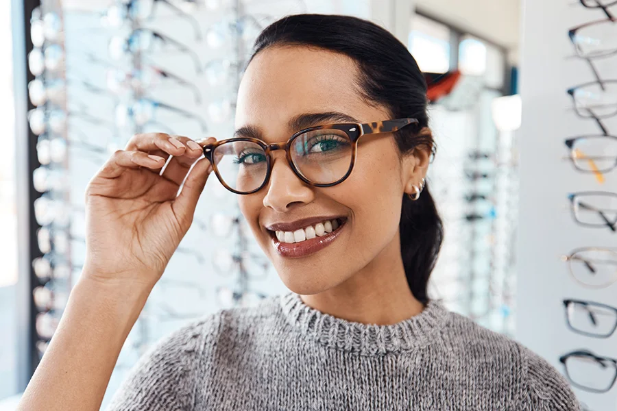 eyewear woman in an eyewear shop trying optical glasses