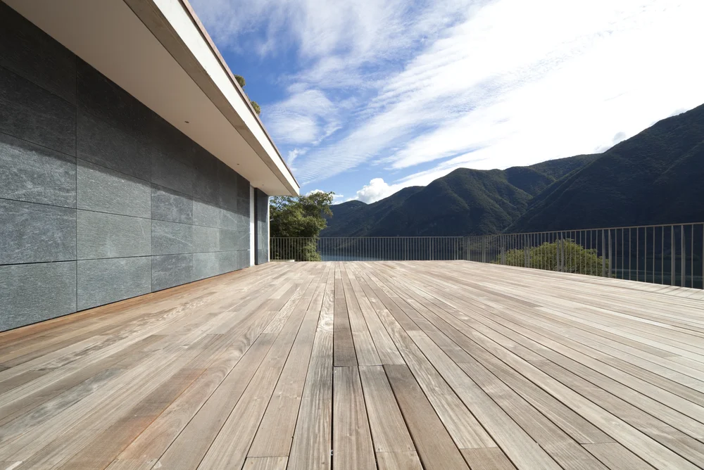 beautiful penthouse, terrace of wood with mountains in the background