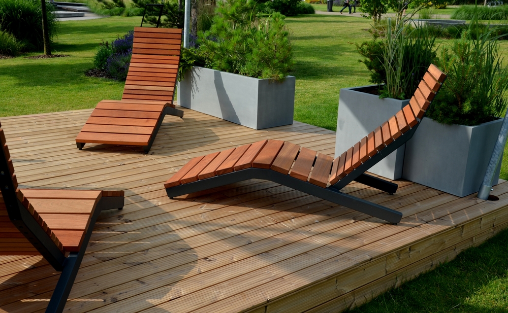 Rocking,Chair,On,The,Pavement,Under,The,Trees,In,The Wooden sunbeds on a deck