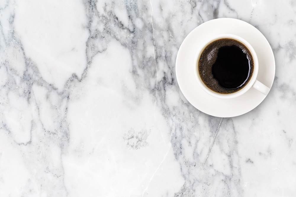 shutterstock_640399204 marble counter top with a cup of coffee